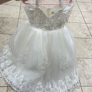 Flower girls dress size 4. Comes with basket and veil